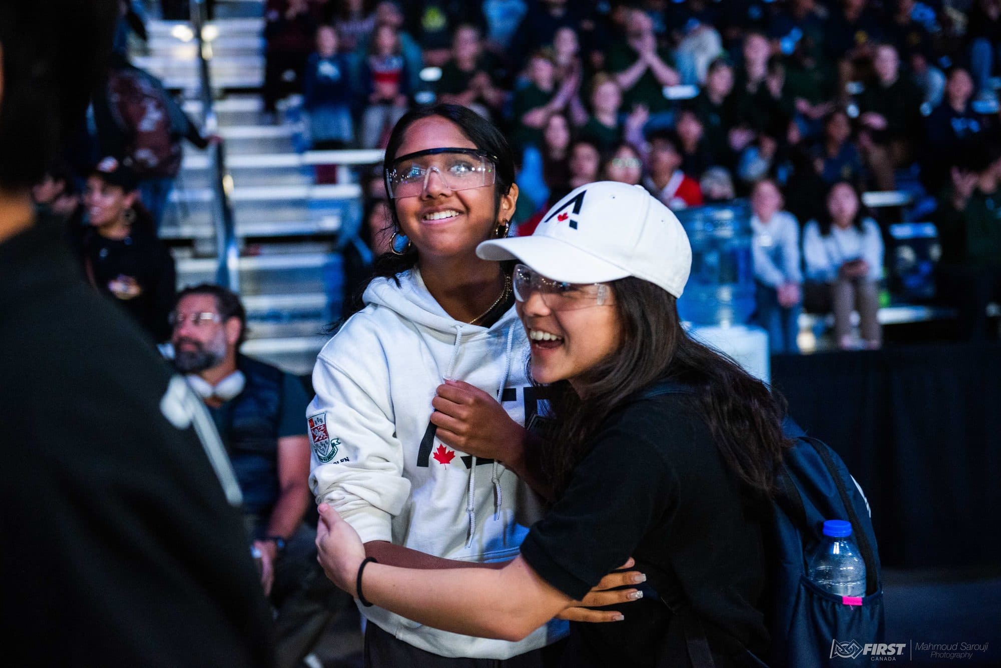 Team members celebrating in the stands at a competition