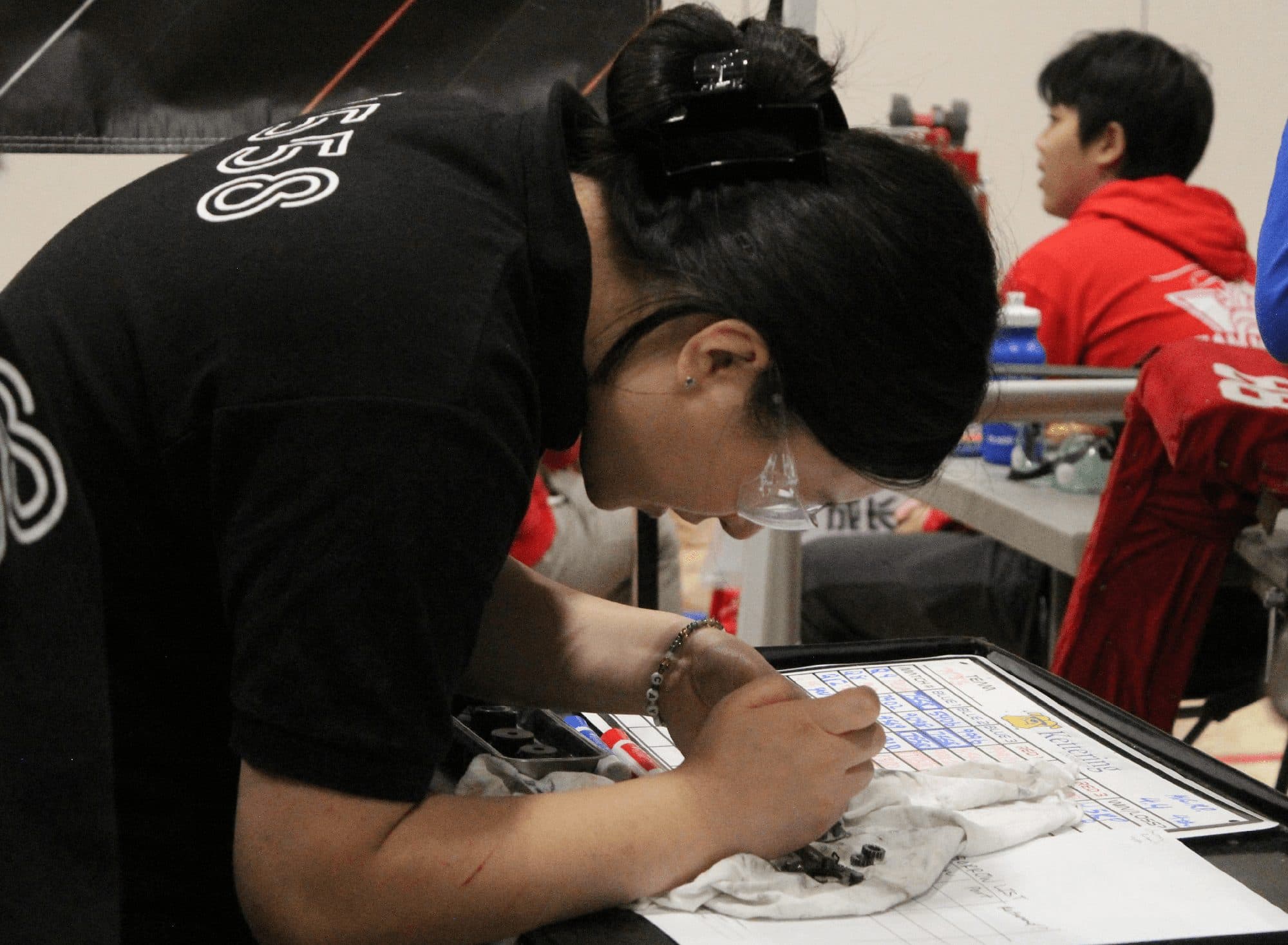 A student sketching a design in the shop